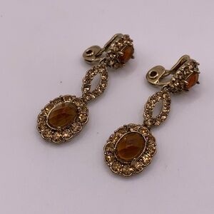 Monet gold tone smoky crystal clip earrings